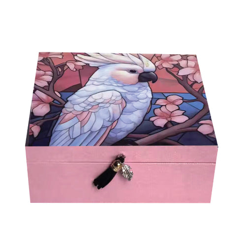 Square trinket box with vibrant bird designs and decorative tassel lid embellishment.