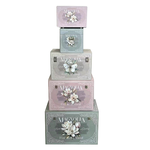 A nesting set of five decorative storage trunks featuring a vintage Magnolia floral design.