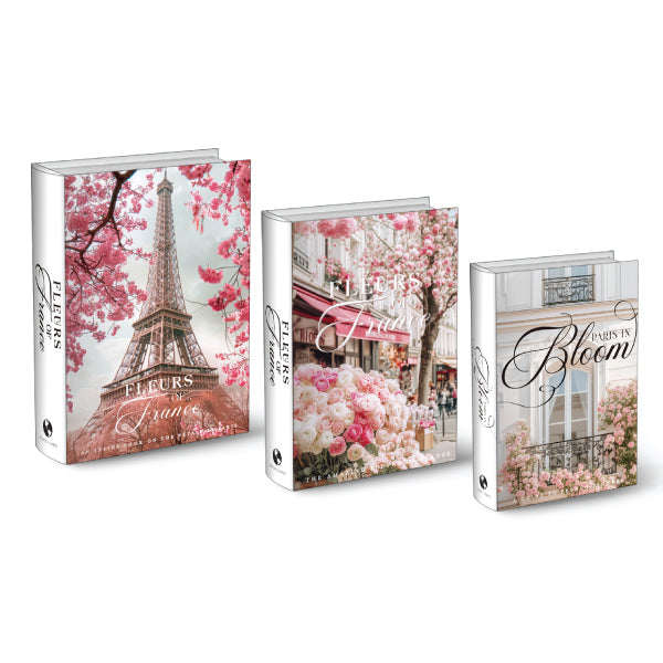 A set of three decorative coffee table books with Parisian floral-themed covers.