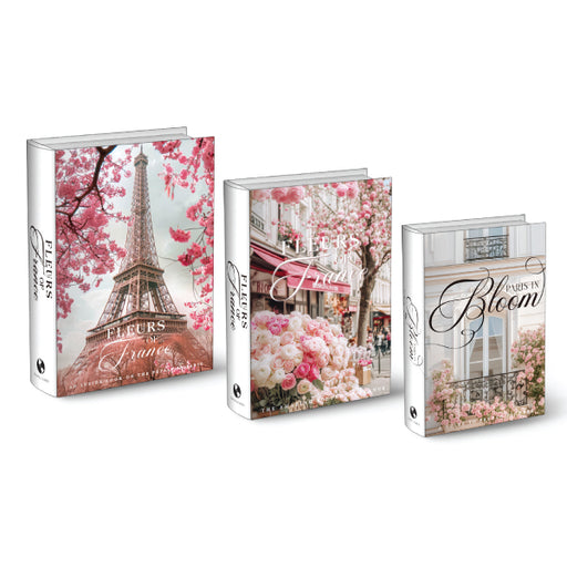 A set of three decorative coffee table books with Parisian floral-themed covers.