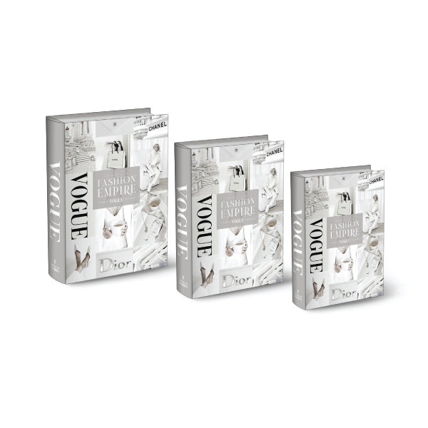 A set of three decorative white stacking books with "Fashion House" themed covers.