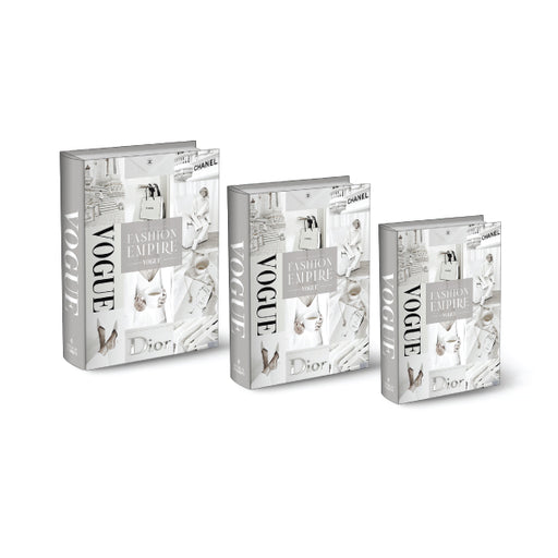 A set of three decorative white stacking books with "Fashion House" themed covers.