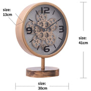 Gold tabletop clock with exposed gears and footed stem base, 41cm