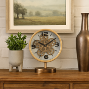 Gold tabletop clock with exposed gears and footed stem base, 41cm