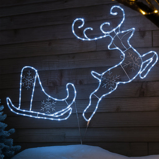 White rope light silhouette of reindeer and sleigh