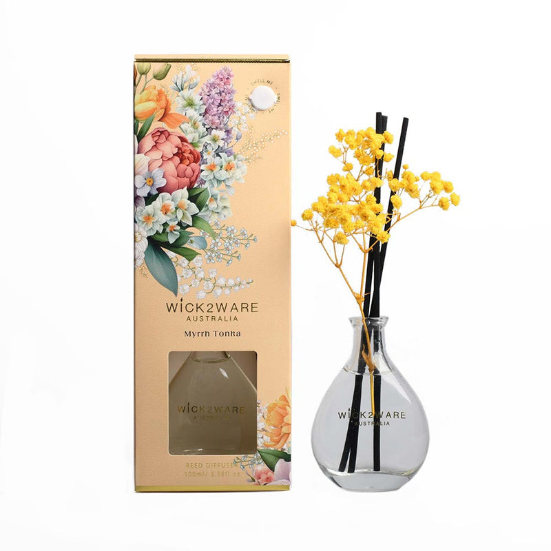 Vessel with dried botanicals dispensing Myrrh Tonka fragrance