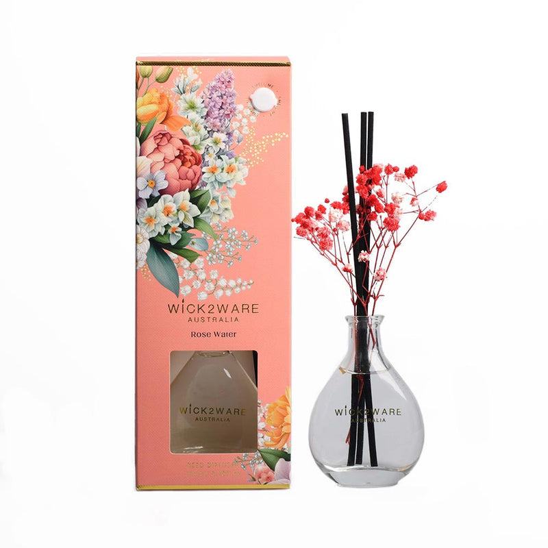 Vessel with dried botanicals dispensing Rose Water fragrance
