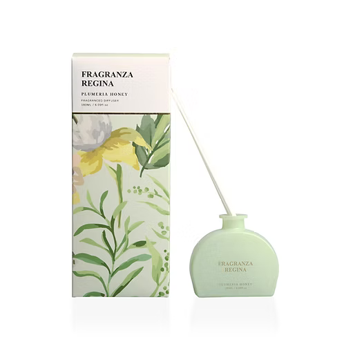 Floral themed vessel dispensing Plumera Honey fragrance