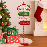 Vertical metal Christmas sign in festive colours, 23x9x57cm, ideal for entryways and seasonal displays