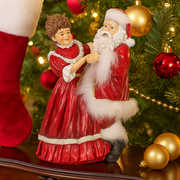 Mr. and Mrs. Claus polyresin figurine set 31.5cm tall in festive attire