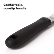 OXO Good Grips Bent Icing Knife with angled stainless steel blade and soft non-slip handle for smooth cake decorating.