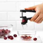 OXO Good Grips Cherry & Olive Pitter in black with stainless steel plunger