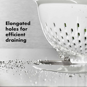 OXO Good Grips Colander with perforated holes, elevated base, and soft non-slip handles.