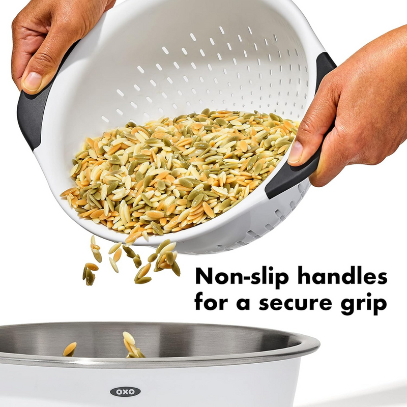 OXO Good Grips Colander with perforated holes, elevated base, and soft non-slip handles.