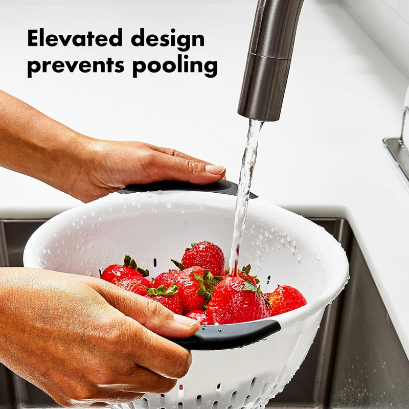 OXO Good Grips Colander with perforated holes, elevated base, and soft non-slip handles.