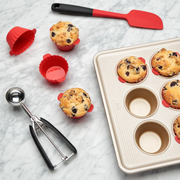 OXO Good Grips Medium Cookie Scoop with stainless steel head and soft spring-loaded non-slip handle.