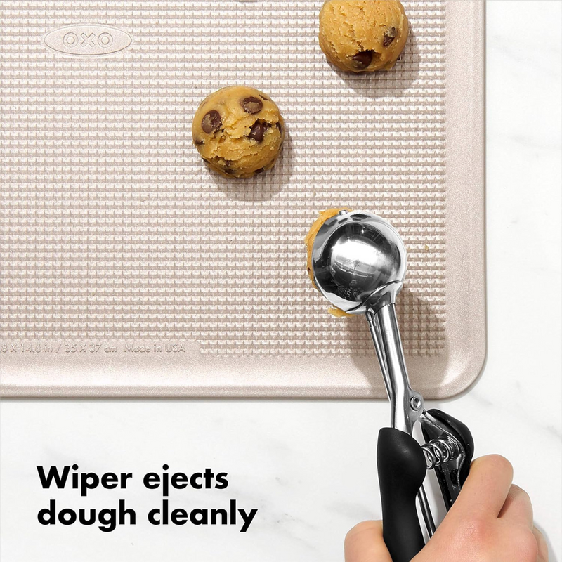 OXO Good Grips Medium Cookie Scoop with stainless steel head and soft spring-loaded non-slip handle.