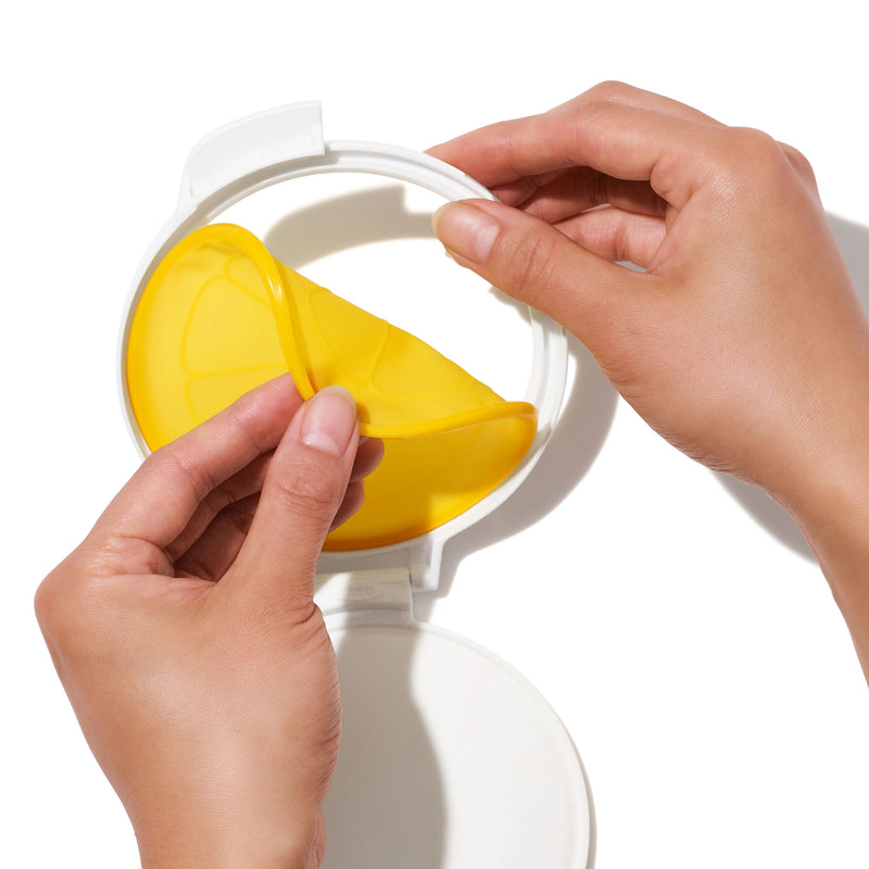 OXO Good Grips Cut & Keep Silicone Lemon Saver with yellow silicone lid and clear base