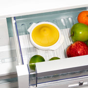 OXO Good Grips Cut & Keep Silicone Lemon Saver with yellow silicone lid and clear base