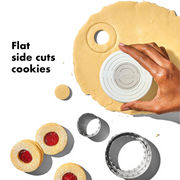 OXO Good Grips Dual Cookie & Biscuit Cutters set with smooth and scalloped stainless steel edges and non-slip handles.