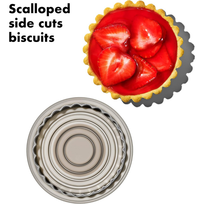 OXO Good Grips Dual Cookie & Biscuit Cutters set with smooth and scalloped stainless steel edges and non-slip handles.