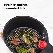 OXO Good Grips Fat Separator 4 Cup / 1L with strainer, stopper, and clear measurement markings.