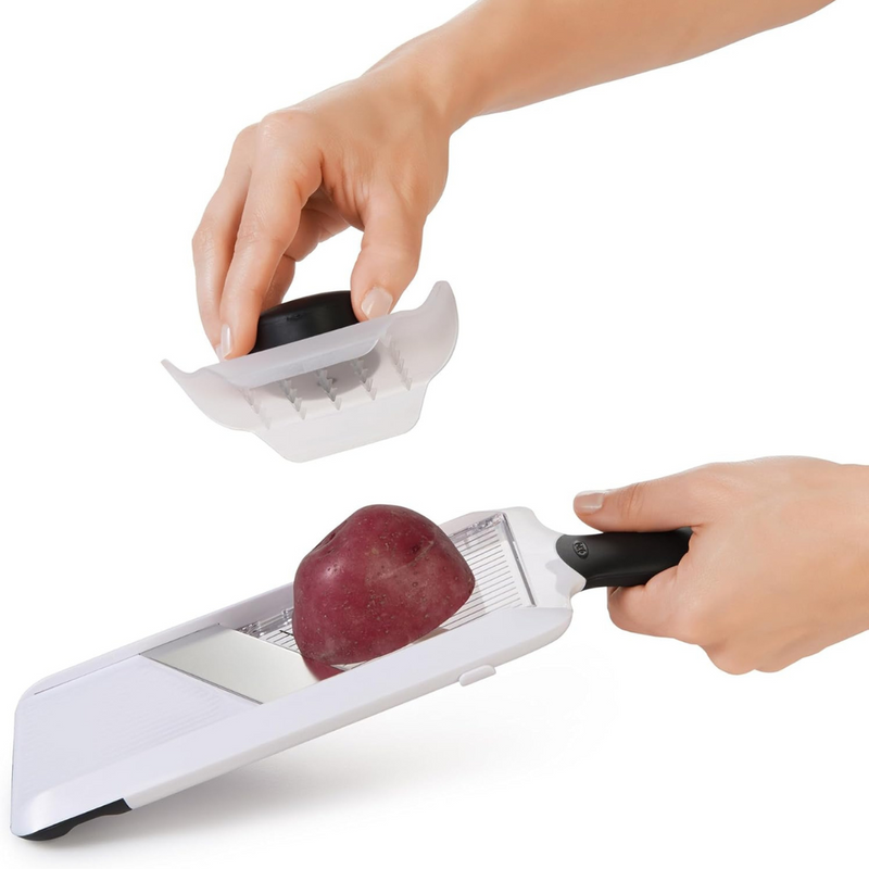 OXO Good Grips Hand-Held Mandoline Slicer with adjustable stainless steel blade and non-slip handle for precise fruit and vegetable slicing.