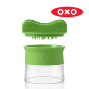 OXO Good Grips Hand-Held Spiralizer with black handle and green body