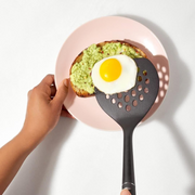 OXO Good Grips Nylon Round Turner with black nylon head and soft non-slip handle.