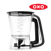 OXO Good Grips Precision Batter Dispenser with drip-free valve, measurement markings, and non-slip handle.