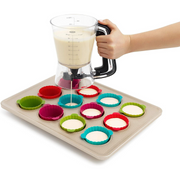 OXO Good Grips Precision Batter Dispenser with drip-free valve, measurement markings, and non-slip handle.