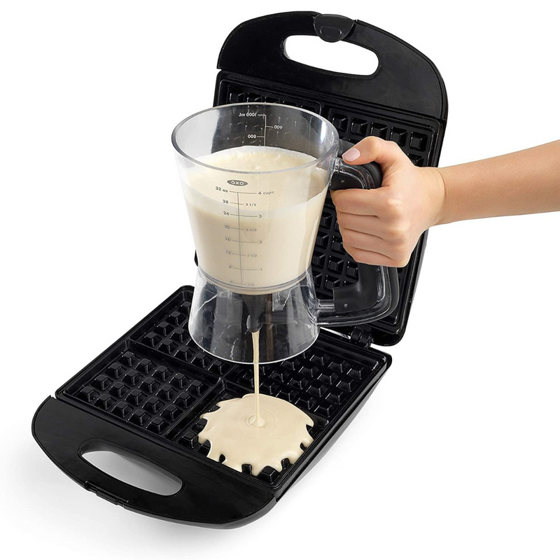 OXO Good Grips Precision Batter Dispenser with drip-free valve, measurement markings, and non-slip handle.