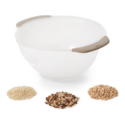 OXO Good Grips Rice and Grain Washing Colander with fine drainage holes and soft non-slip handles.