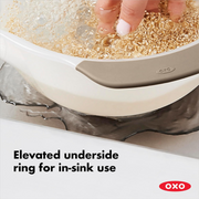 OXO Good Grips Rice and Grain Washing Colander with fine drainage holes and soft non-slip handles.