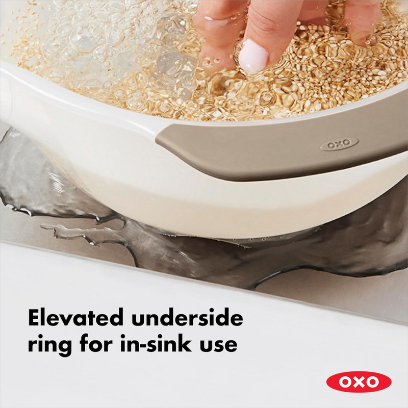 OXO Good Grips Rice and Grain Washing Colander with fine drainage holes and soft non-slip handles.
