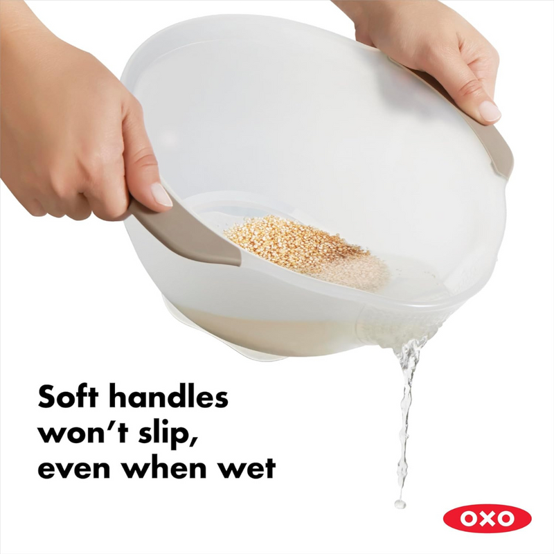 OXO Good Grips Rice and Grain Washing Colander with fine drainage holes and soft non-slip handles.