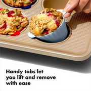 OXO Good Grips Silicone Baking Cups 12-Pack in assorted colours with non-stick interior and batter fill line.