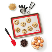 OXO Good Grips Silicone Baking Mat with measurement markings, non-stick surface, and half-sheet pan fit.