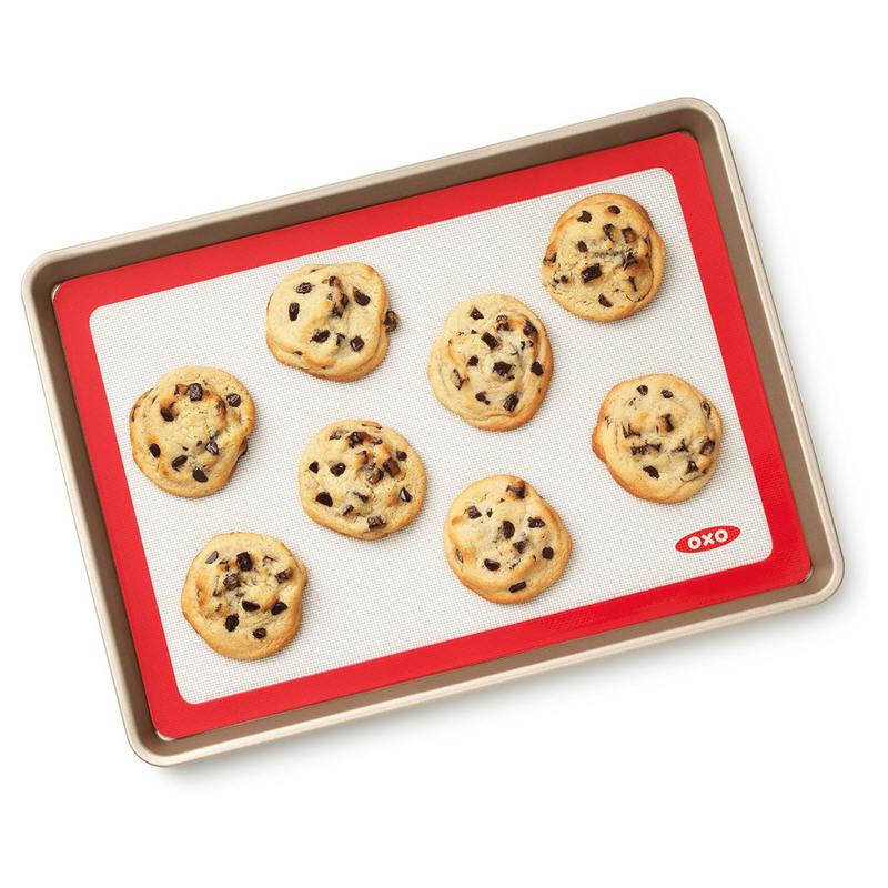 OXO Good Grips Silicone Baking Mat with measurement markings, non-stick surface, and half-sheet pan fit.