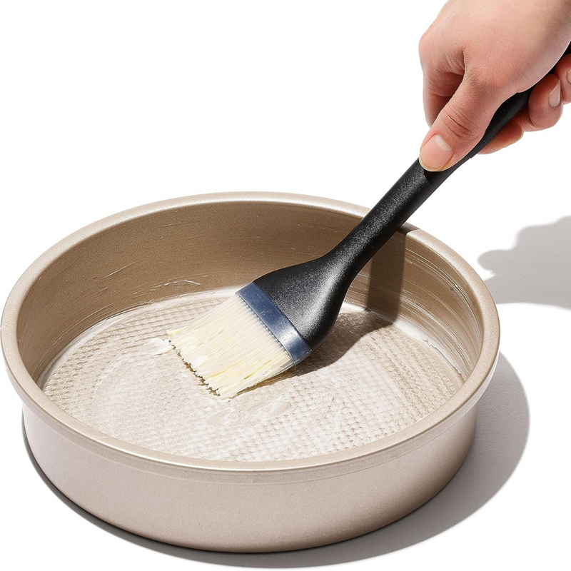 OXO Good Grips Silicone Basting Brush with heat-resistant bristles and non-slip handle for even sauce coating.