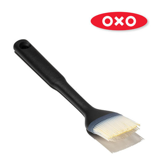 OXO Good Grips Silicone Basting Brush with heat-resistant bristles and non-slip handle for even sauce coating.
