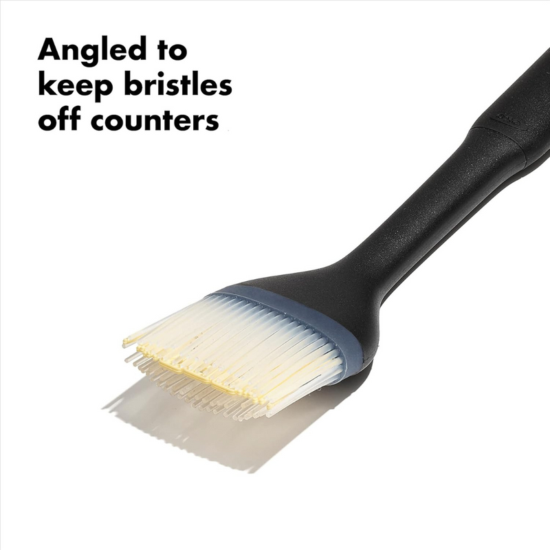 OXO Good Grips Silicone Basting Brush with heat-resistant bristles and non-slip handle for even sauce coating.