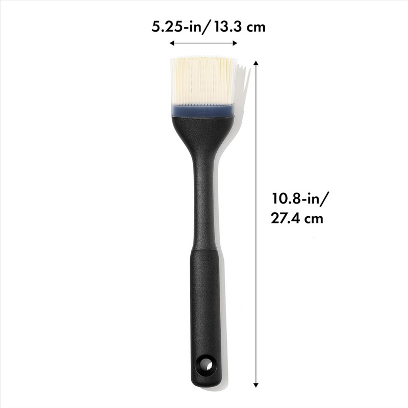 OXO Good Grips Silicone Basting Brush with heat-resistant bristles and non-slip handle for even sauce coating.