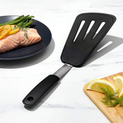 OXO Good Grips Silicone Flexible Omelet Turner with extra-wide heat-resistant head and non-slip handle.