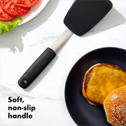 OXO Good Grips Small Silicone Flexible Turner with thin heat-resistant head and non-slip handle.