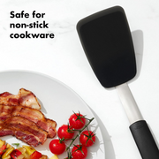 OXO Good Grips Small Silicone Flexible Turner with thin heat-resistant head and non-slip handle.