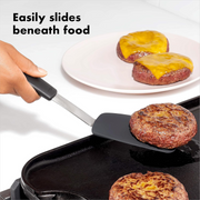 OXO Good Grips Small Silicone Flexible Turner with thin heat-resistant head and non-slip handle.