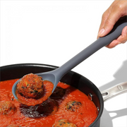 OXO Good Grips Silicone Spoon with black silicone head and soft non-slip handle.