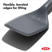 OXO Good Grips Silicone Turner with black silicone head and soft non-slip handle.