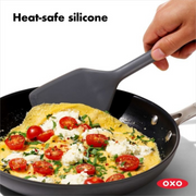 OXO Good Grips Silicone Turner with black silicone head and soft non-slip handle.